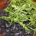 Fettuccine al nero di seppia con pomodoro e rucola