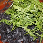 Fettuccine al nero di seppia con pomodoro e rucola